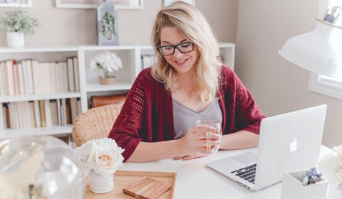 smiling woman working at home, mental health and working from home