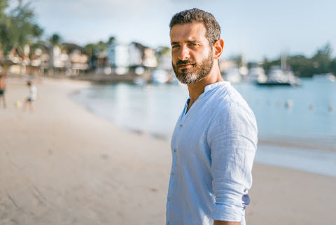 Man standing on a beach.